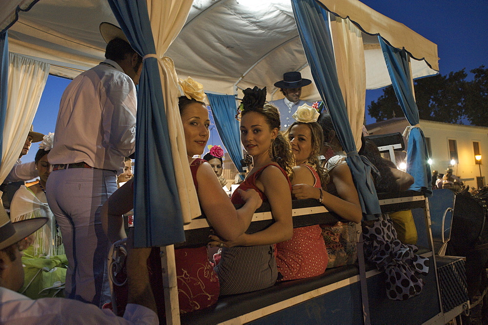 Pilgrims in a carriage in front of the church Eremita del Rocio at El Rocio at Pentecost, Huelva, Andalusien, Spanien