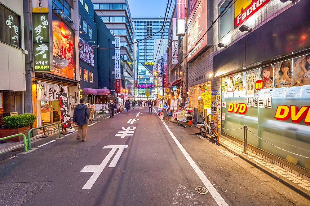 Pedestrians in side street during blue hour at Akihabara, Chiyoda-ku, Tokyo, Japan