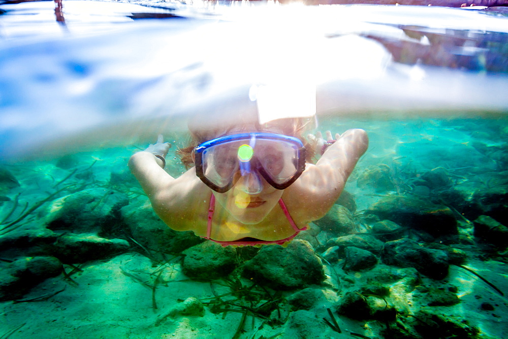 nine yeares old girl swimming with the mask, Cala s’Almunia, Mallorca, Balearic Islands, Spain