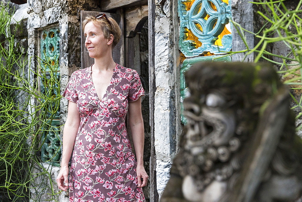 Woman near a door to a hotel, Sanur, Denpasar, Bali, Indonesia