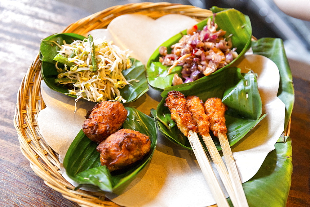 Traditional Balinese food served in banana leaves, Gado-Gado, Sate, Tempe, Ubud, Gianyar, Bali, Indonesia