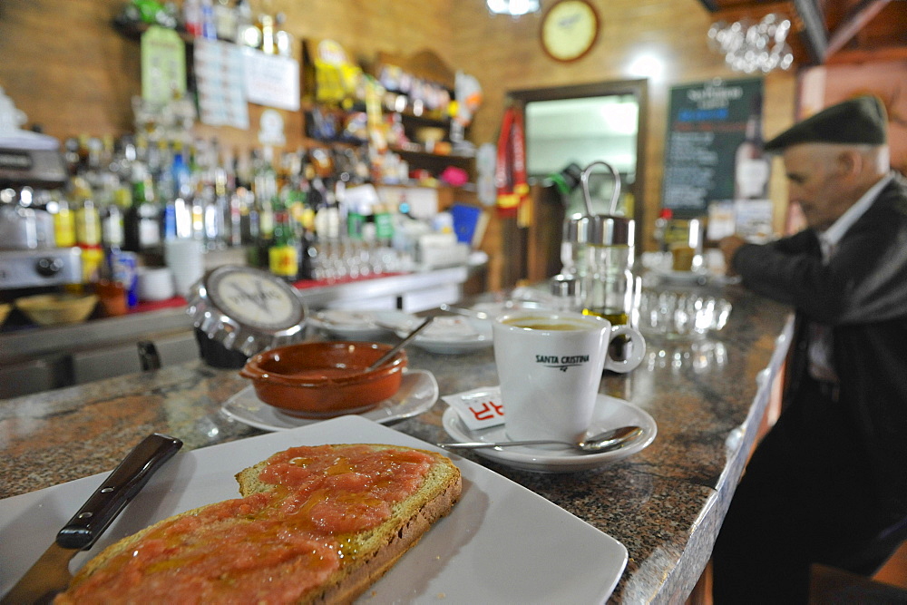 Breakfast with toasted bread and coffee in a bar in Algatocin, Serrania de Ronda, Andalusia, Spain