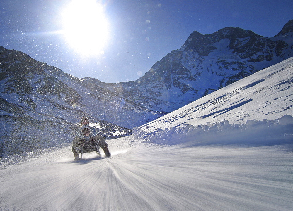 Mother and son on sledge, Lazaun run, Schnals Valley, South Tyrol, Italy, MR