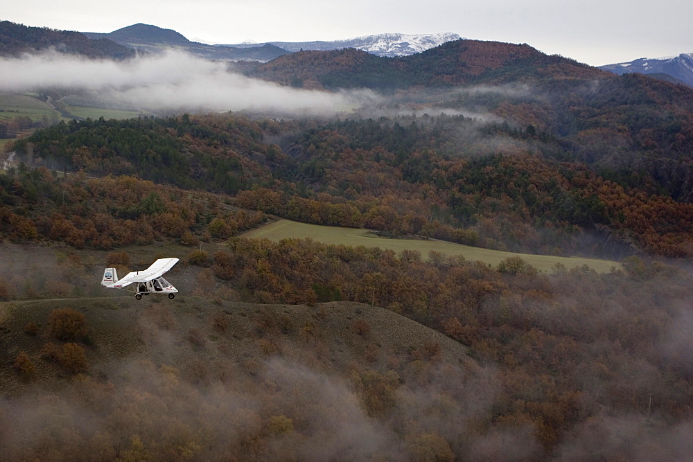 Aerial view of ULM plane above the mountains, South France, Europe