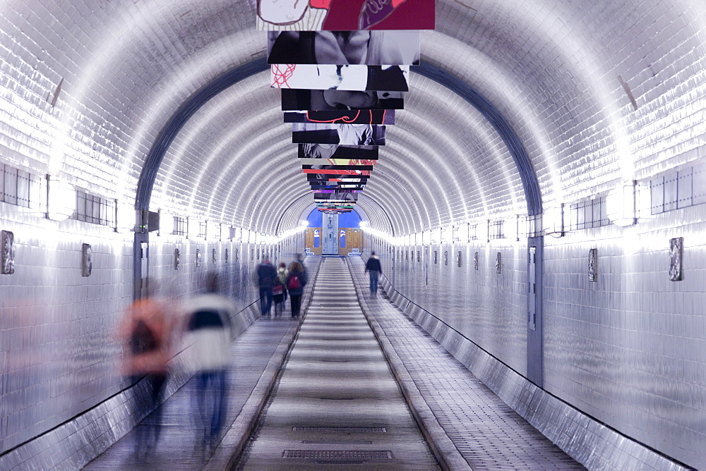 Pedestrians in the Old Elbe Tunnel, Hamburg, Germany