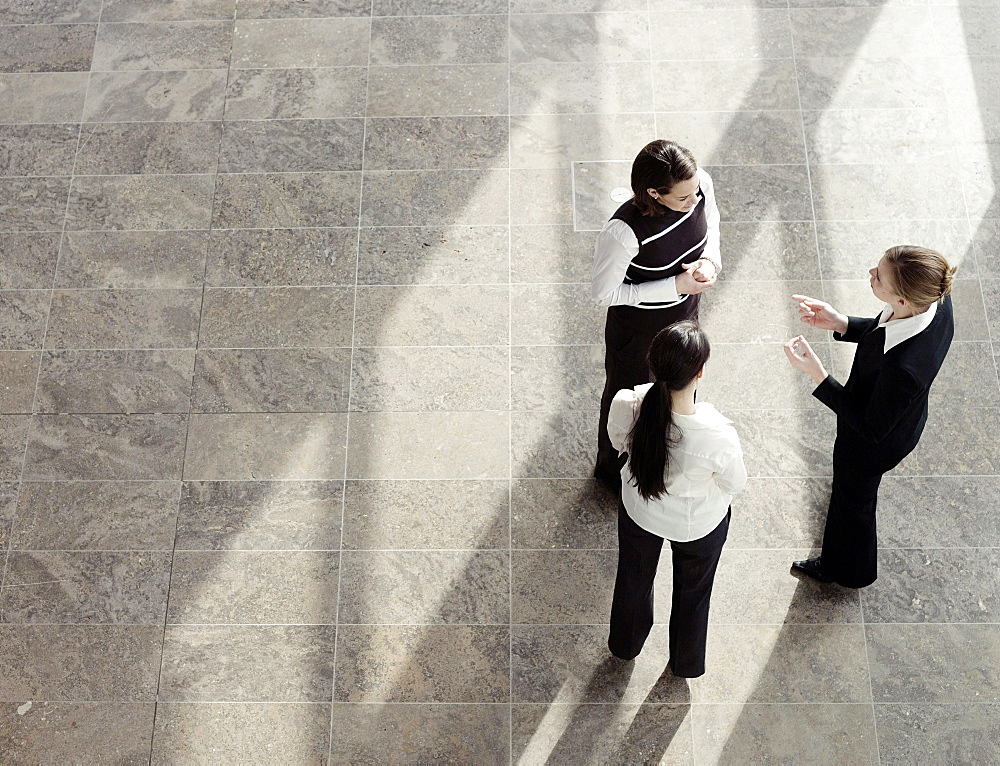 Three businesswomen talking, Munich, Bavaria, Germany