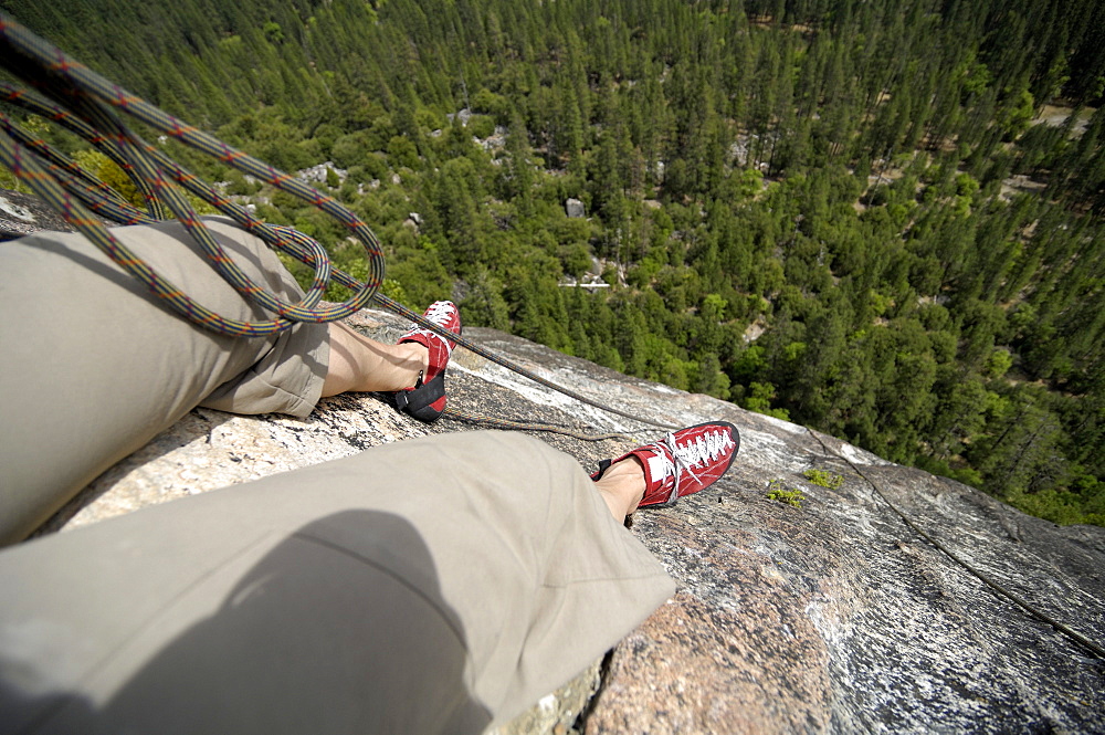 Mid adult woman with climbing rope, Yosemite National Park, California, USA