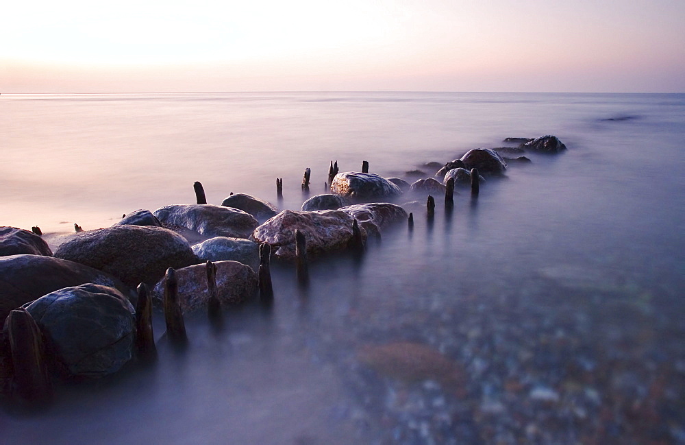 Leavings of a groyne and stones, coastline of Baltic Sea, Schleswig-Holstein, Germany