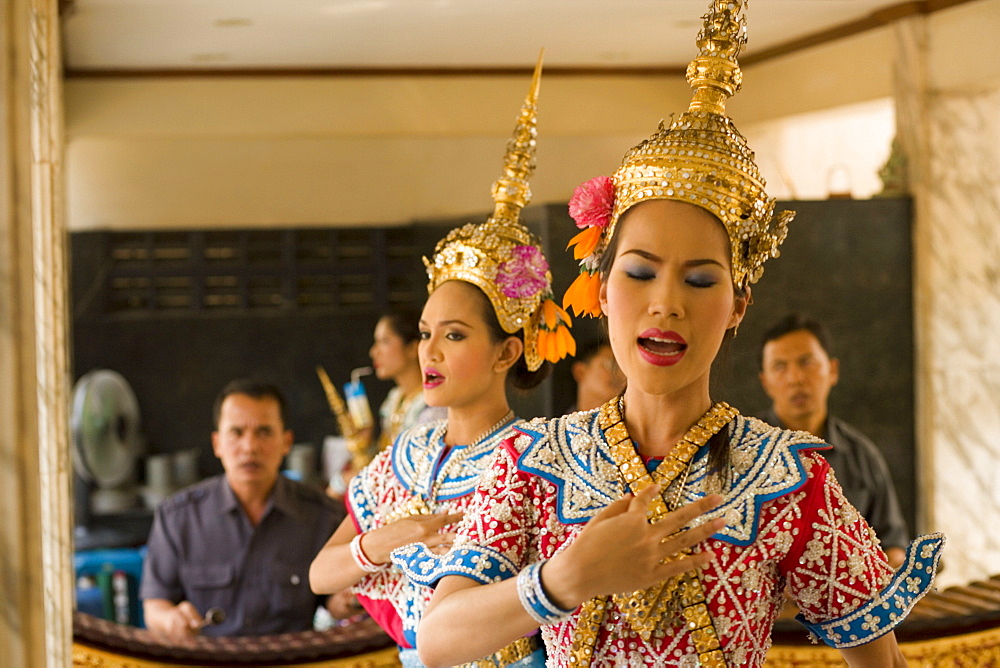 Traditional Thai dancers performing for Brahma, they dancing on request for donations, Erawan Shrine, Ratchadamri Road near Siam Square, Pathum Wan District, Bangkok, Thailand