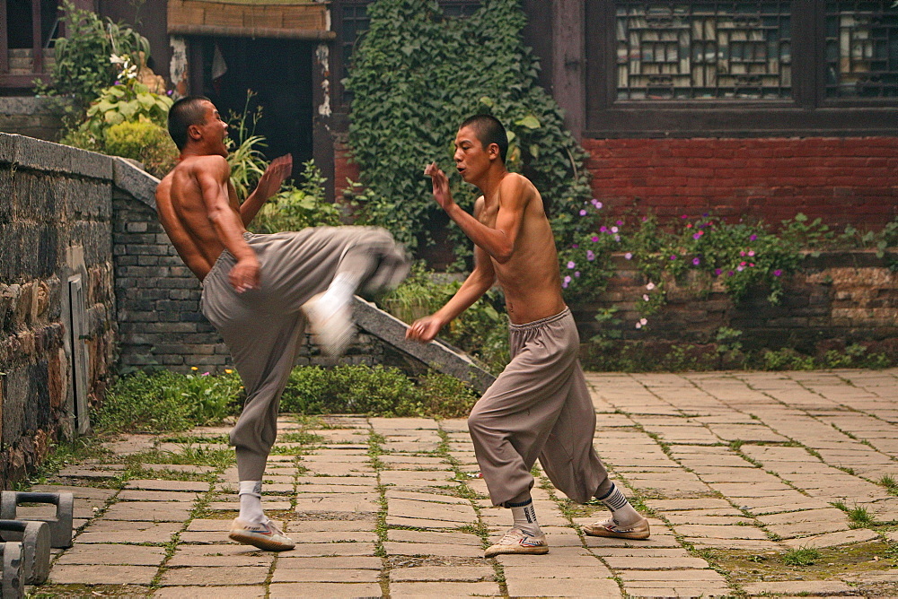 duel and training between two Shaolin monks, Shaolin Monastery, known for Shaolin boxing, Taoist Buddhist mountain, Song Shan, Henan province, China, Asia