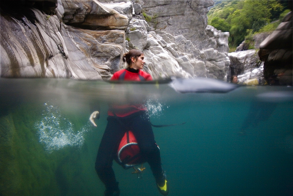 Young woman in Maggia Gorge, Valle Maggia, Ponte Brolla, Canton Ticino, Switzerland, MR