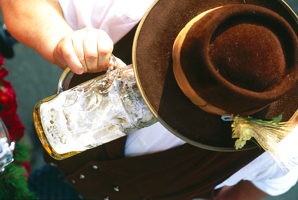 Drayman drinking a liter of beer , Oktoberfest, Munich