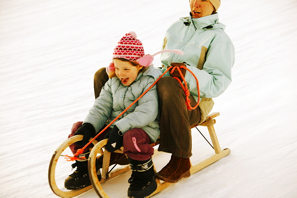 Mother and daughter sledding, Kuhtai, Tyrol, Austria