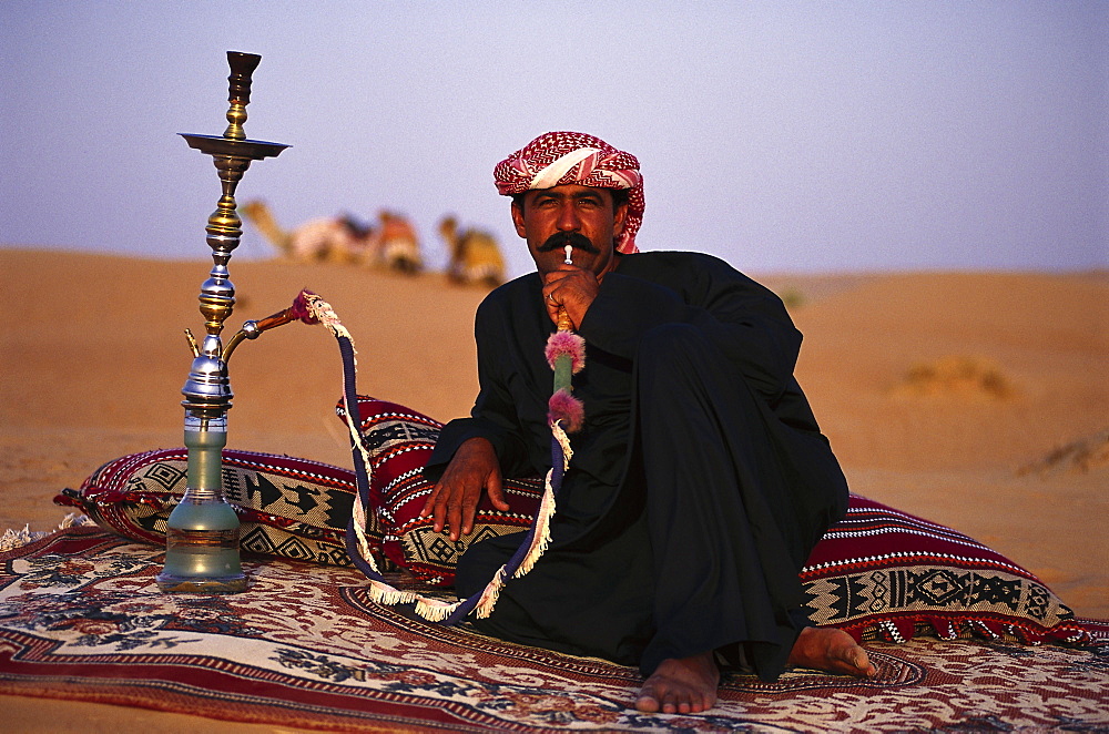 Bedouin with shisha at the desert in the evening, Dubai, V.A.E., United Arab Emirates, Middle East, Asia