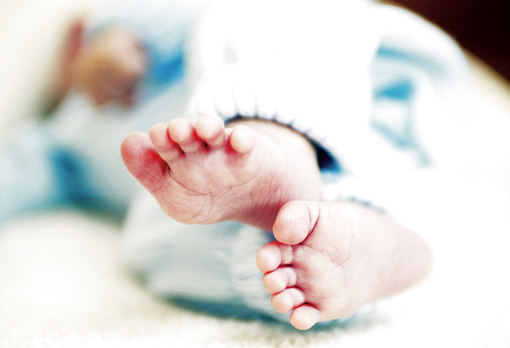 Feet of a baby, lying on back