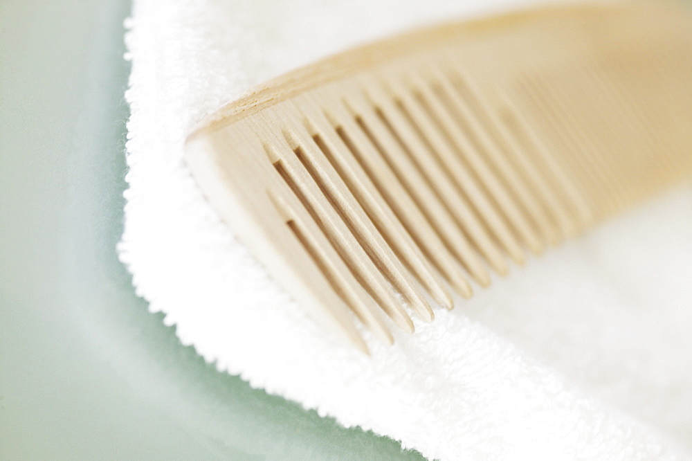 Wooden comb and towel