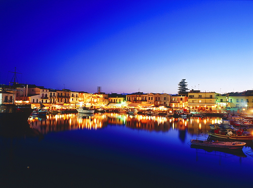 Venetian Harbour at night with restaurants, Réthimnon, Crete, Greece