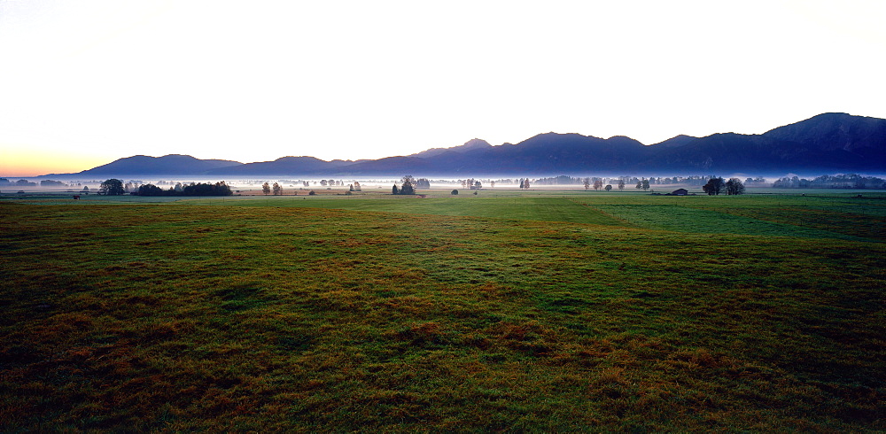 Alpine upland spire in misty landscape, Sunrise, Upper Bavaria, Bavaria, Germany