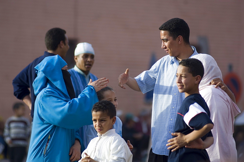 People having a conversation, Jemaa el Fna Square, Marrakech, Morocco