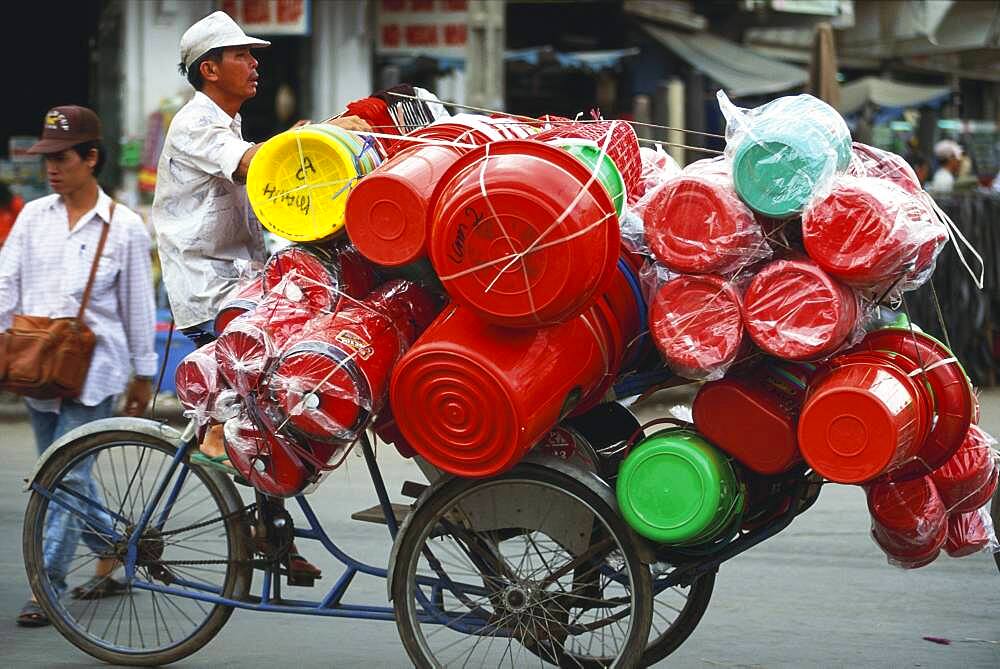 Trader with goods on a bicycle, Chinatown, Saigon, Vietnam, Asia