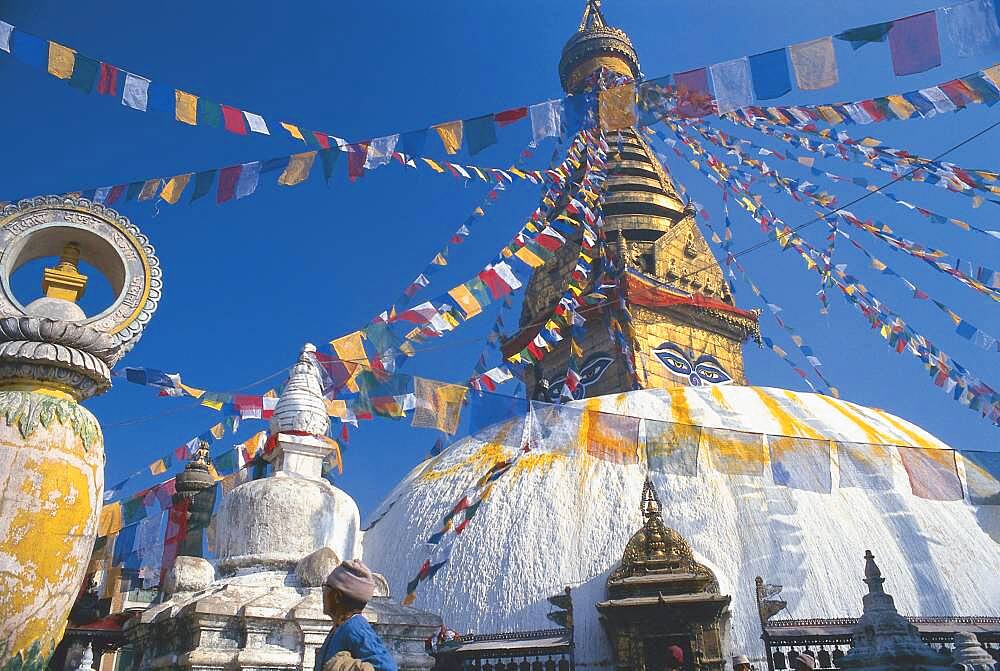 Prayer flags at stupa of Swayambunath under blue sky, Kathmandu, Nepal, Asia