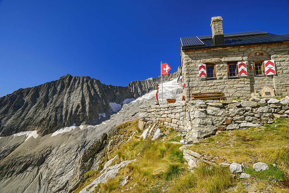 Hut Baltschiederklause with Swiss flag, Baltschiederklause, Bernese Alps, Valais, Switzerland