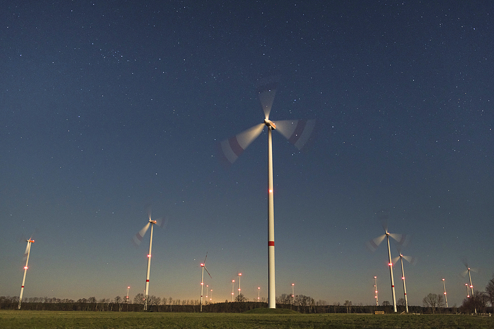 Wind farm in front of starry sky, Germany, Brandenburg,