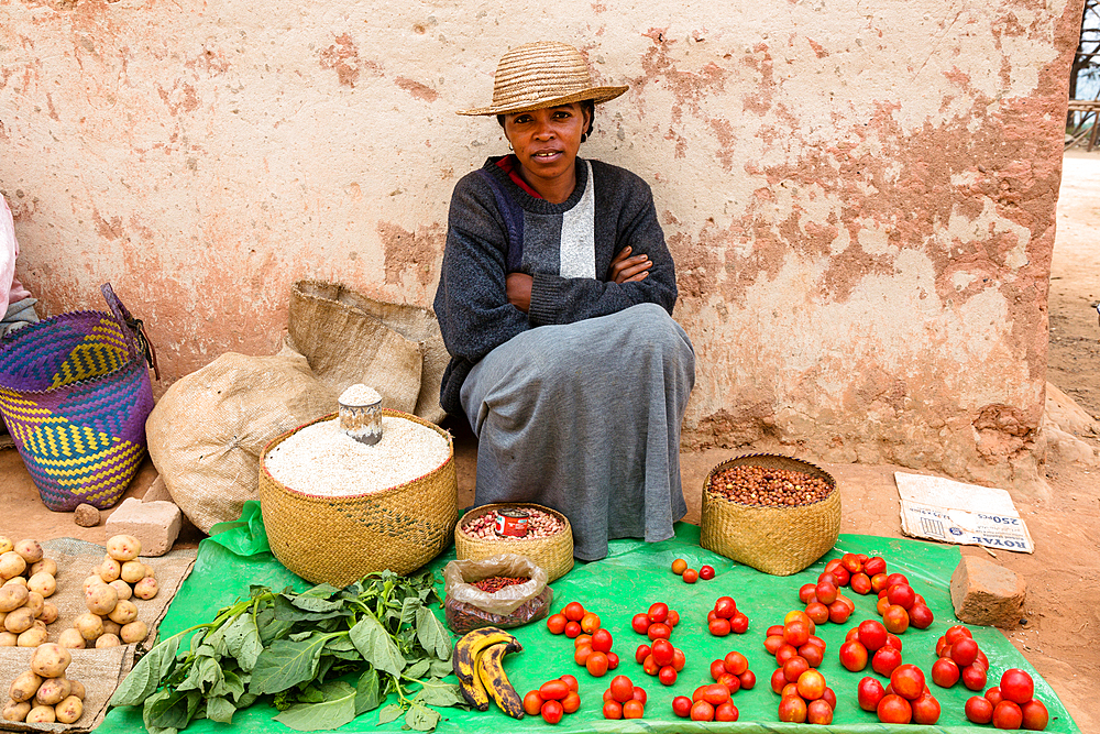 Woman offers vegetables for sale, Sendrisoa, Ambalavao Region, Central Highlands, Madagascar, Africa