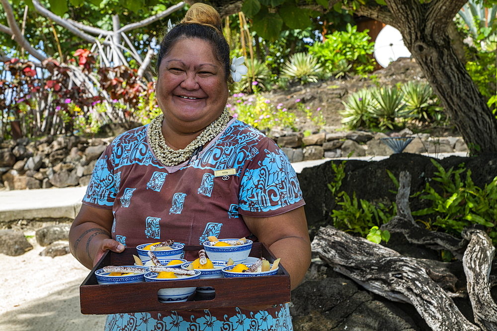 Friendly waitress with tray of ice cream at Sofitel Bora Bora Private Island Resort, Bora Bora, Leeward Islands, French Polynesia, South Pacific