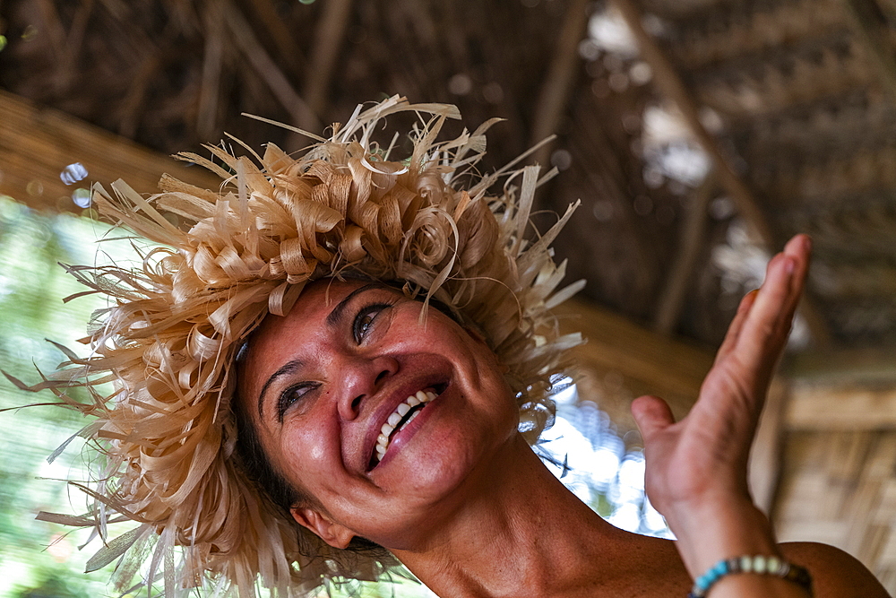 Happy Tahitian woman during an immersion workshop in the ELK cultural village, Apootaata, Moorea, Windward Islands, French Polynesia, South Pacific