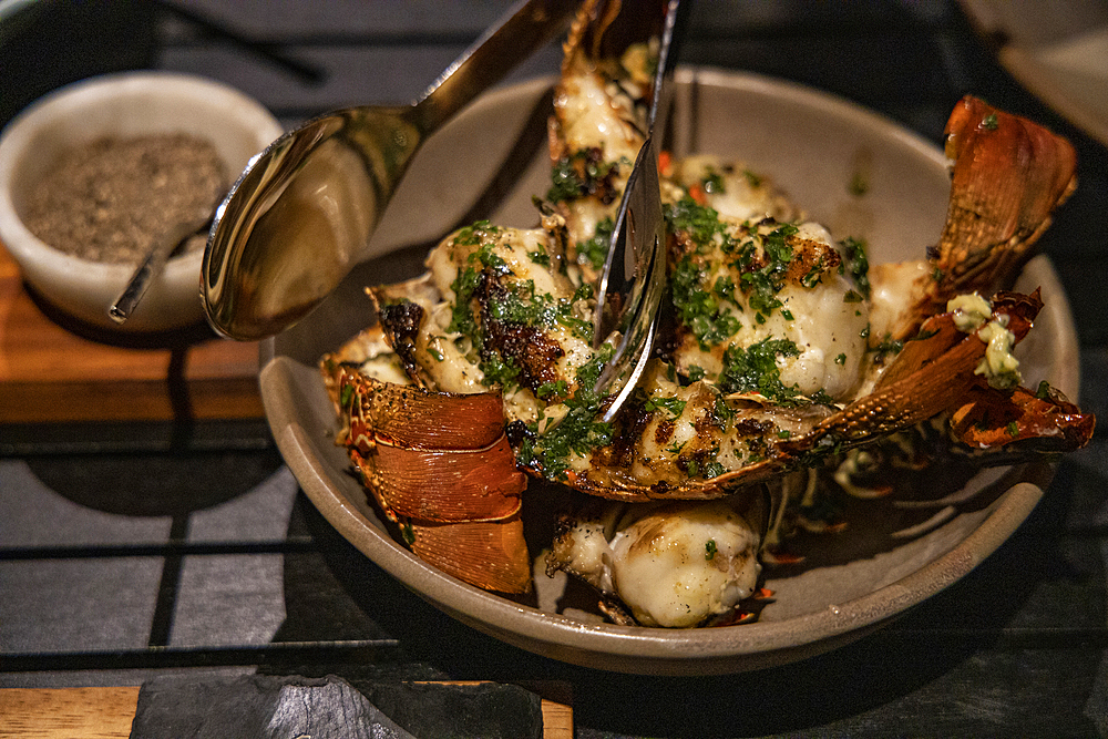 Grilled lobster is served during a barbecue evening in a Residence Villa accommodation at Six Senses Fiji Resort, Malolo Island, Mamanuca Group, Fiji Islands, South Pacific