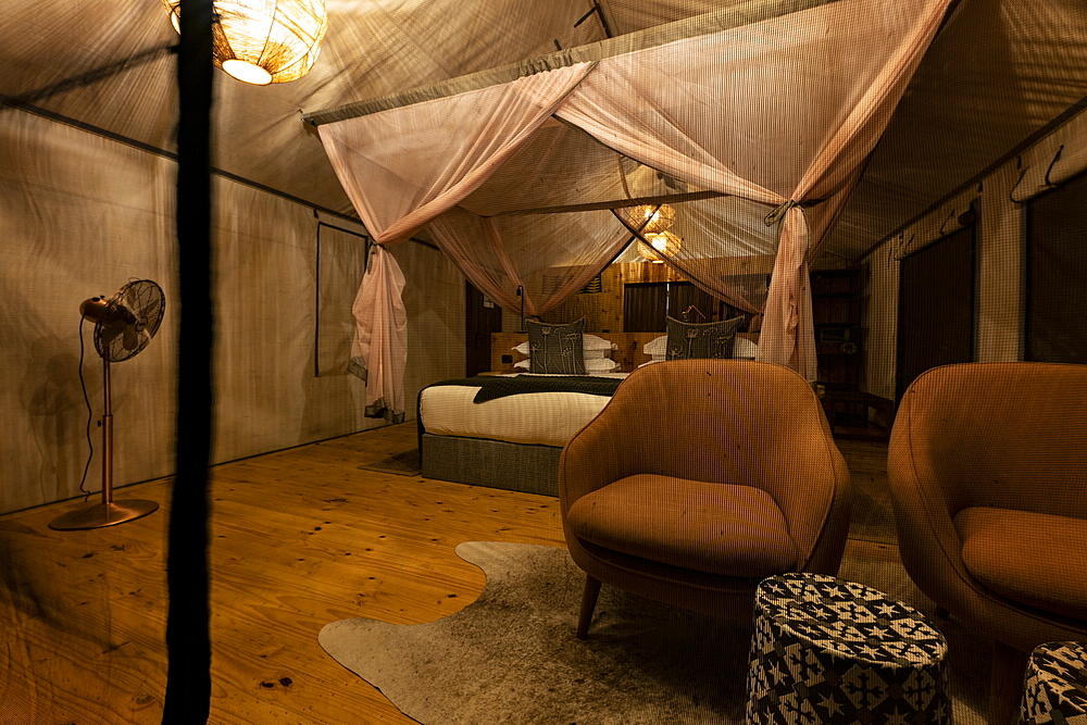 Interior of a luxury tent accommodation in the luxury resort tented camp Magashi Camp (Wilderness Safaris), Akagera National Park, Eastern Province, Rwanda, Africa