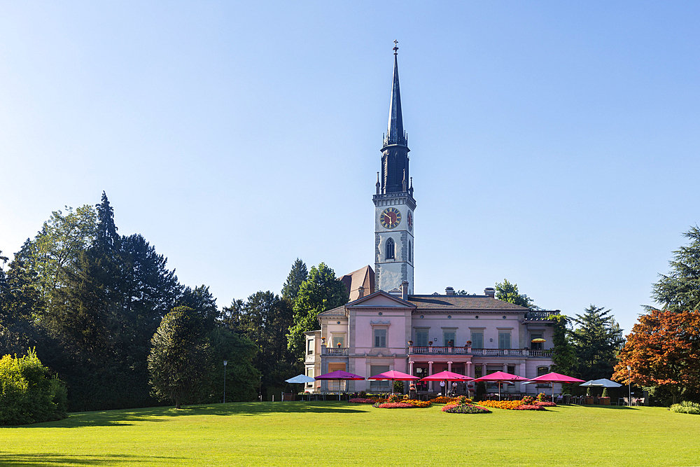 Seerestaurant and behind it St. Jakob in Cham in the canton of Zug, Switzerland