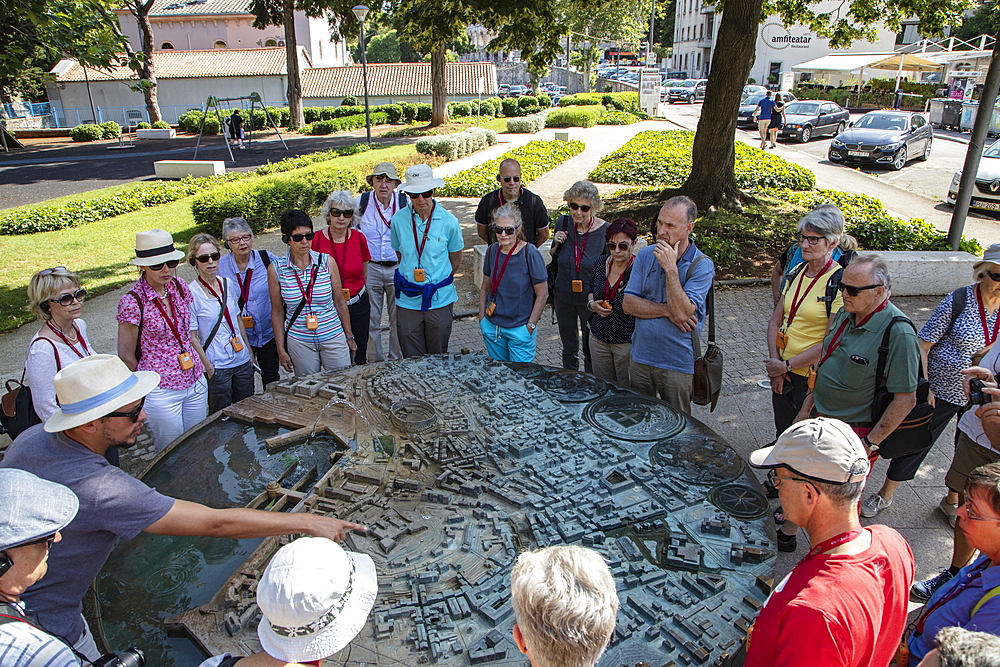 Tour group at the model of the city, Pula, Istria, Croatia, Europe