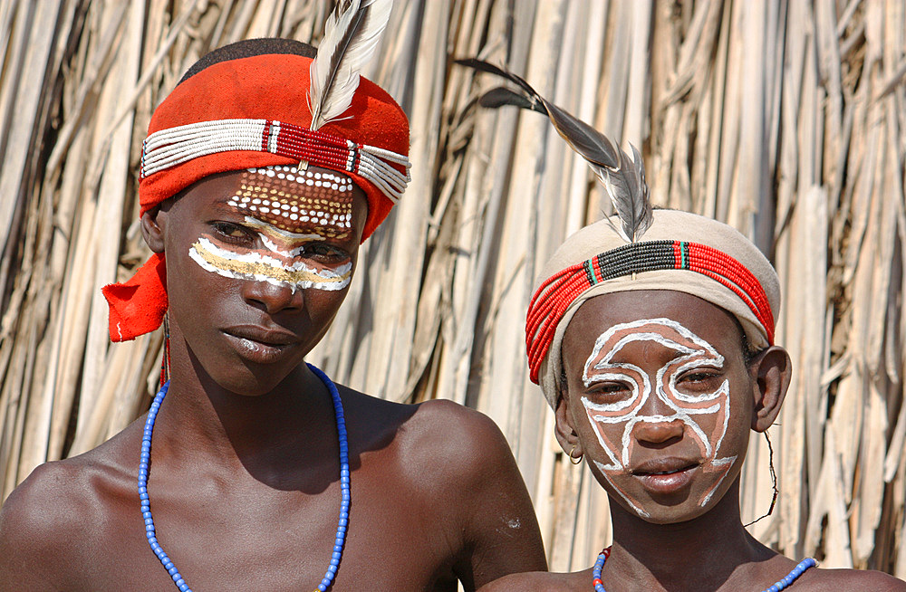 Ethiopia; Southern Nations Region; southern Ethiopian highlands; two boys of the Arbore people; with with headdress and face painting; Arbore tribal area between Turmi and the village of Arbore