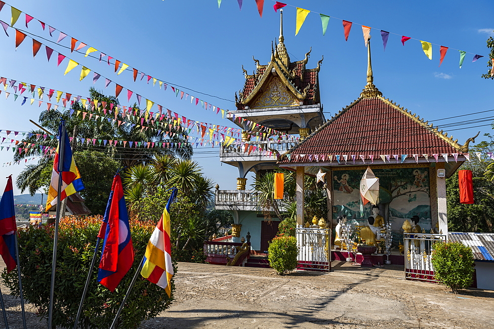 Colorful flags at the Vat Chom Khao Manilat Temple, Houayxay (Huay Xai), Bokeo Province, Laos, Asia