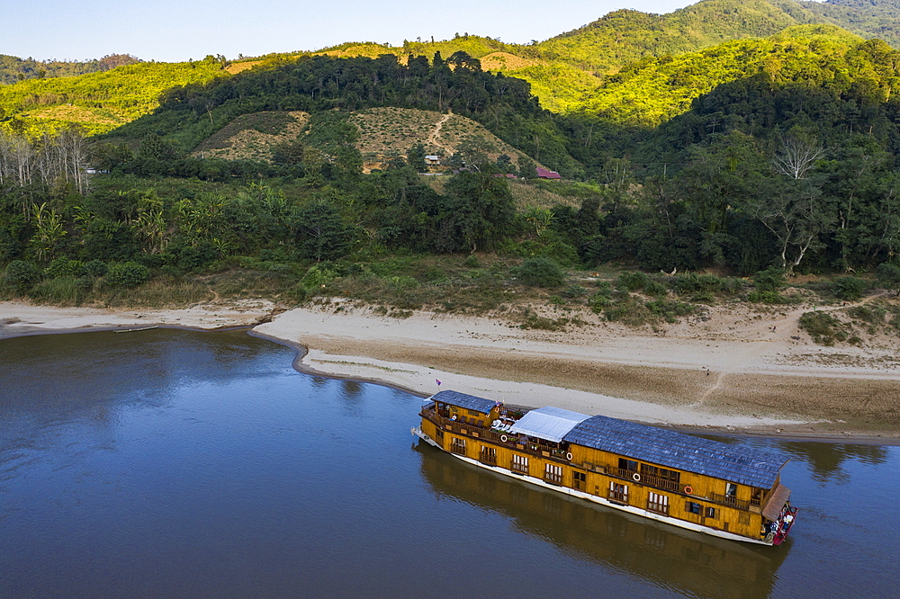 Aerial view of river cruise ship Mekong Sun moored on the sandy bank of the Mekong River, Ban Hoy Palam, Pak Tha District, Bokeo Province, Laos, Asia