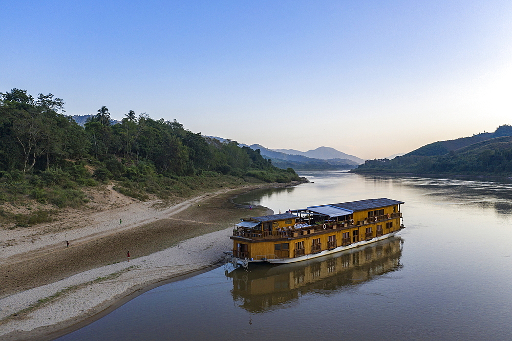 Aerial view of river cruise ship Mekong Sun moored on the sandy bank of the Mekong River, Ban Hoy Palam, Pak Tha District, Bokeo Province, Laos, Asia