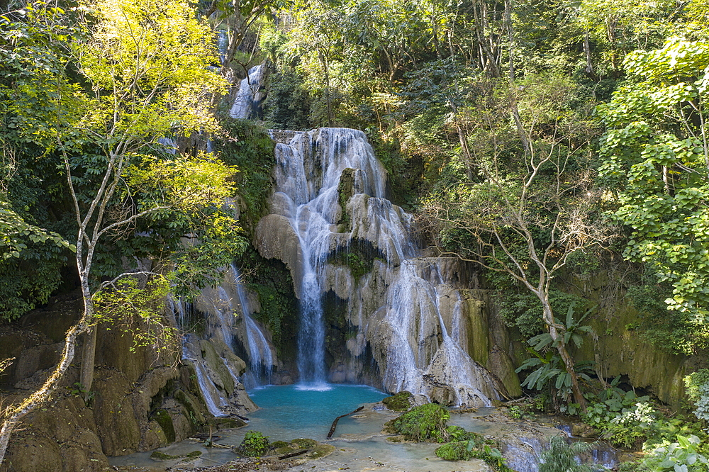 Aerial view of the magnificent Kuang Si Falls amidst lush jungle vegetation, Kuang Si, Luang Prabang Province, Laos, Asia