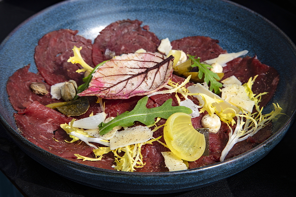 Delicacies prepared by chef Boy Schuiling from restaurant 't Paakhuus Texel are served on board the 1902 sailing ship Iselmar during the Wadden Sea crossing from Harlingen to Terschelling, West Frisian Islands, Friesland, Netherlands, Europe