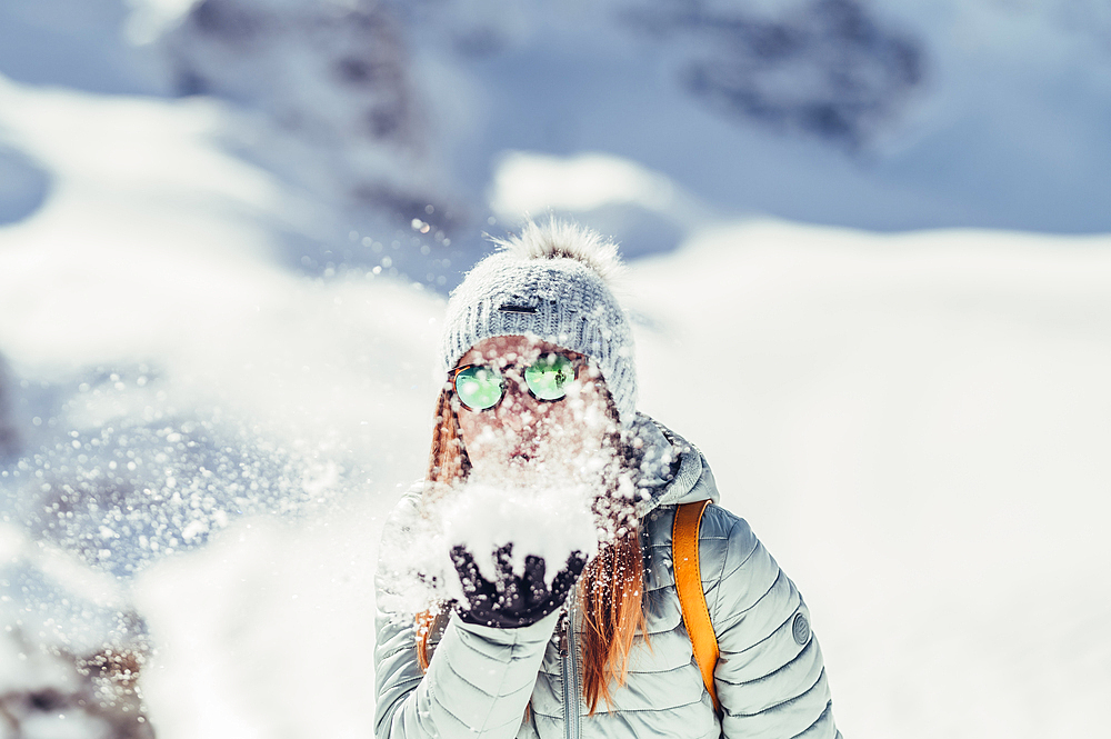 Woman is happy in the snow, Diavolezza, Upper Engadin, Grisons, Switzerland, Europe