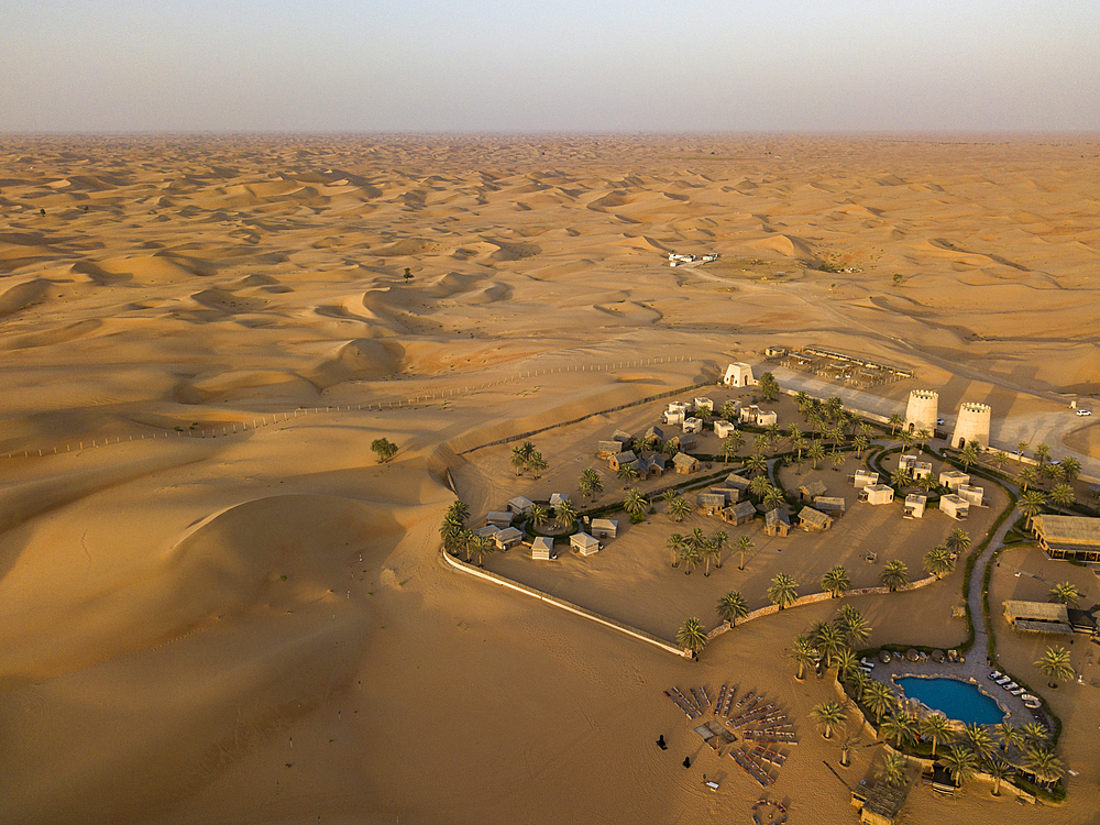 Aerial view of Arabian Nights Village desert resort amidst dunes, Arabian Nights Village, Razeen Area of Al Khatim, Abu Dhabi, United Arab Emirates, Middle East