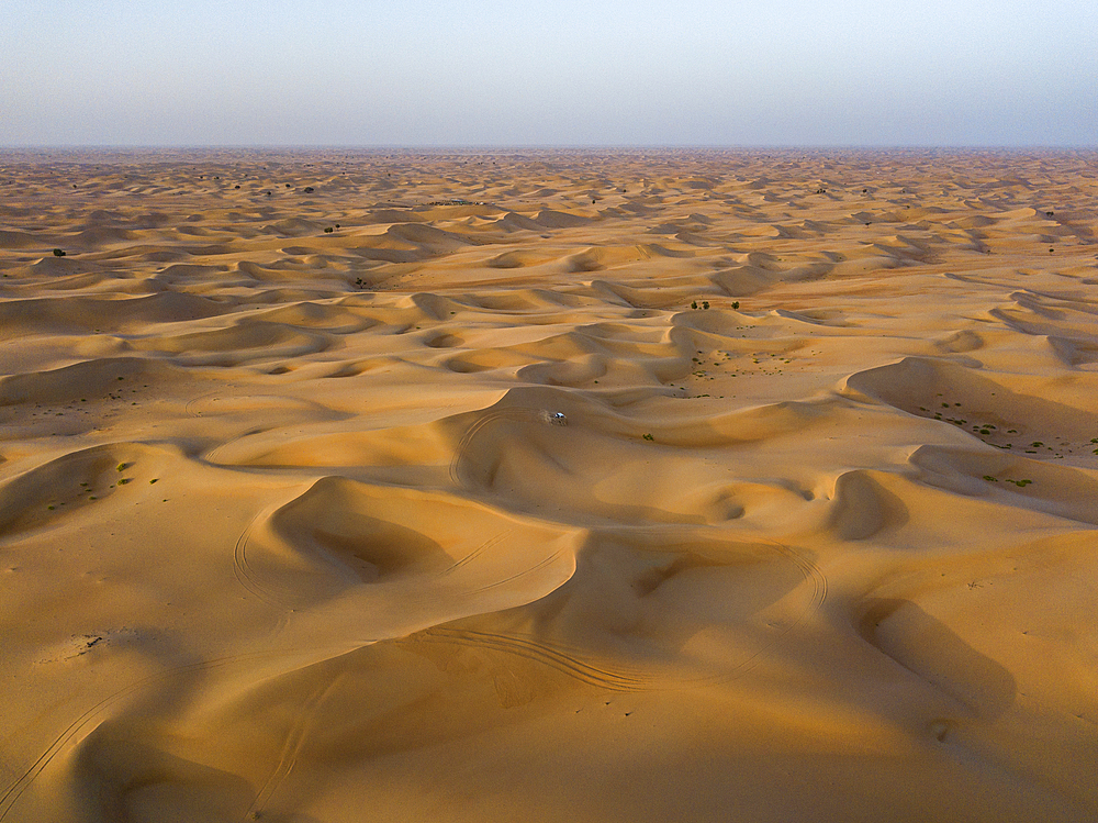 Aerial view of a four-wheel drive vehicle in dunes during a "dune bashing" excursion in the desert, Arabian Nights Village, Razeen Area of Al Khatim, Abu Dhabi, United Arab Emirates, Middle East