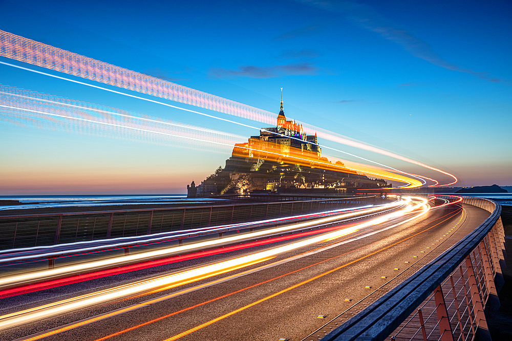 Evening view of the rocky island of Mont Saint Michel with the monastery of the same name, Normandy, France.