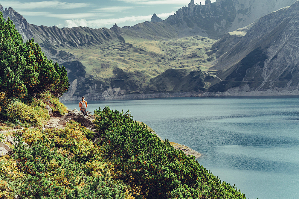 Woman hiking on Lünersee, Vorarlberg, Austria, Europe