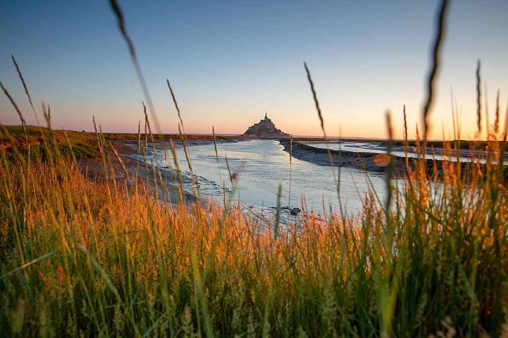 Morning view of the rocky island of Mont Saint Michel with the monastery of the same name, Normandy, France.