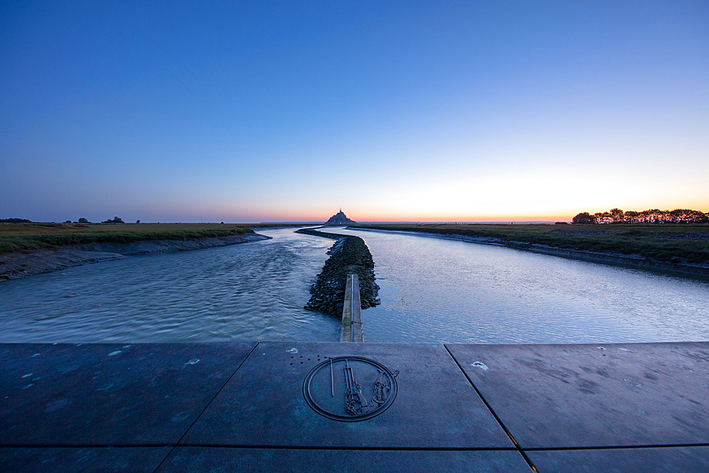 Morning view of the rocky island of Mont Saint Michel with the monastery of the same name, Normandy, France.