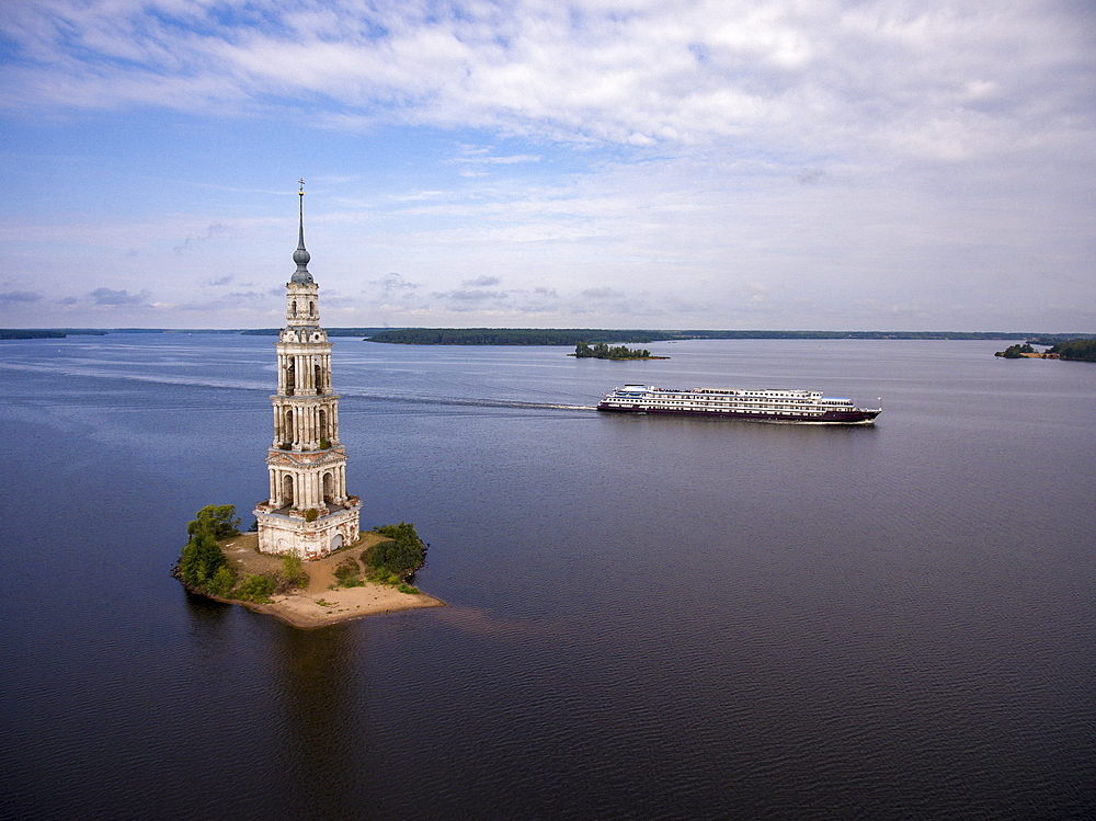 Aerial view of the river cruise ship Excellence Katharina (formerly MS General Lavrinenkov) while passing the Kalyazin bell tower in the Volga river (which is all that is left of the old town of Kalyazin after the Uglich reservoir was flooded), Kalyazin,