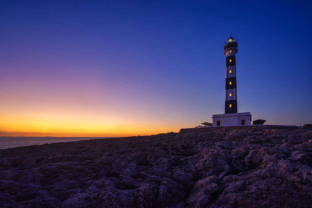 The lighthouse from Cap d'Artrutx at sunset, Ciutadella. Menorca, Balearic Islands, Spain, Europe