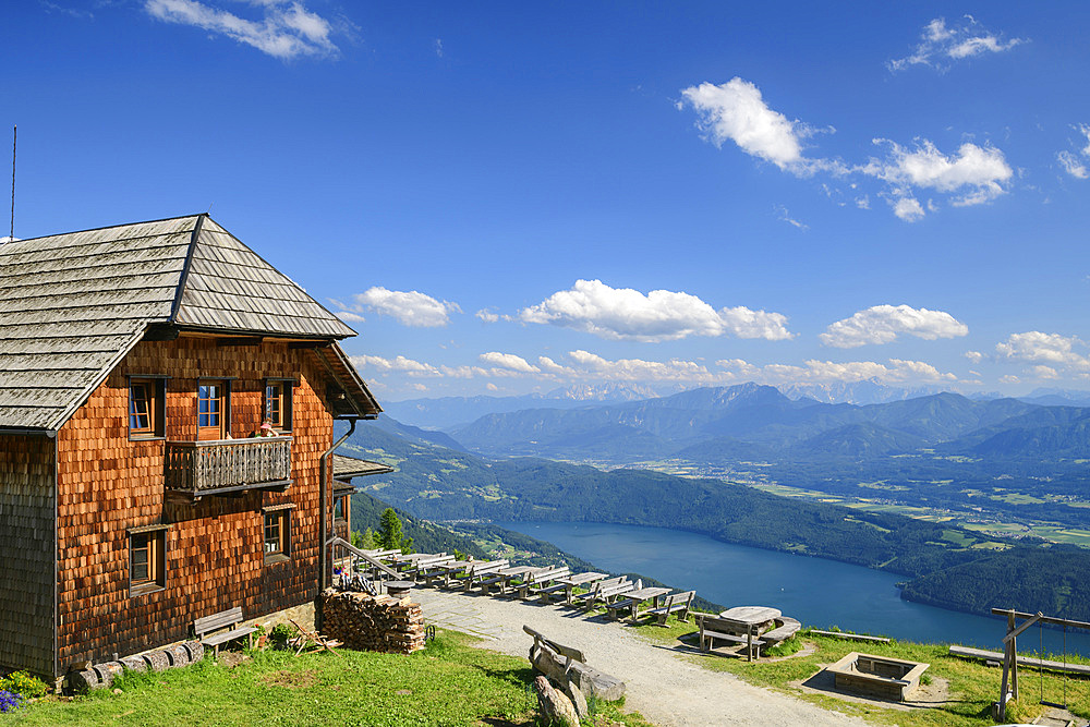 Mountain hut with Lake Millstatt in the background, Alexanderhütte, Nockberge, Nockberge-Trail, UNESCO Biosphere Park Nockberge, Gurktal Alps, Carinthia, Austria